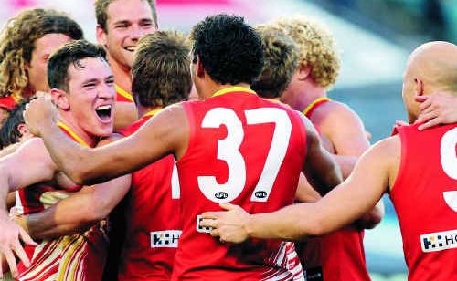 Gold Coast Suns show their feelings after recording their first win in the AFL competition. Gold Coast Suns show their feelings after recording their first win in the AFL competition.
